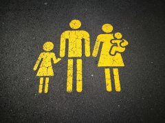 A road painted with a family in yellow meant to symbolize spending time together, even and especially when someone is in recovery from substance abuse.