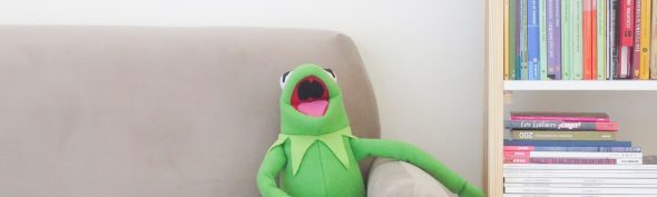 kermit the frog on a couch laughing to reinforce the idea that laughter is a powerful recovery tool in substance abuse recovery